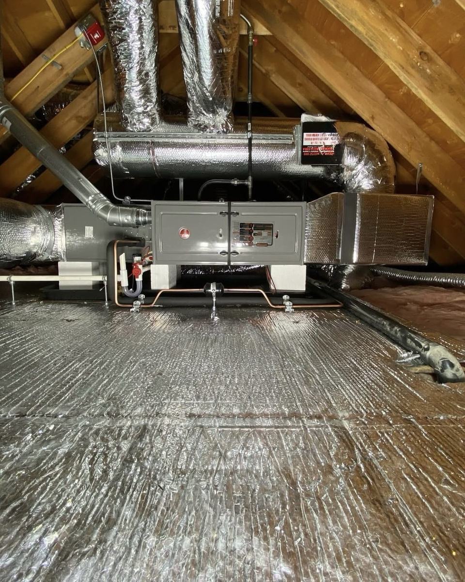 Furnace with new sealed ductwork installed in a Bay Area attic by Jordan Heating and Air Conditioning.