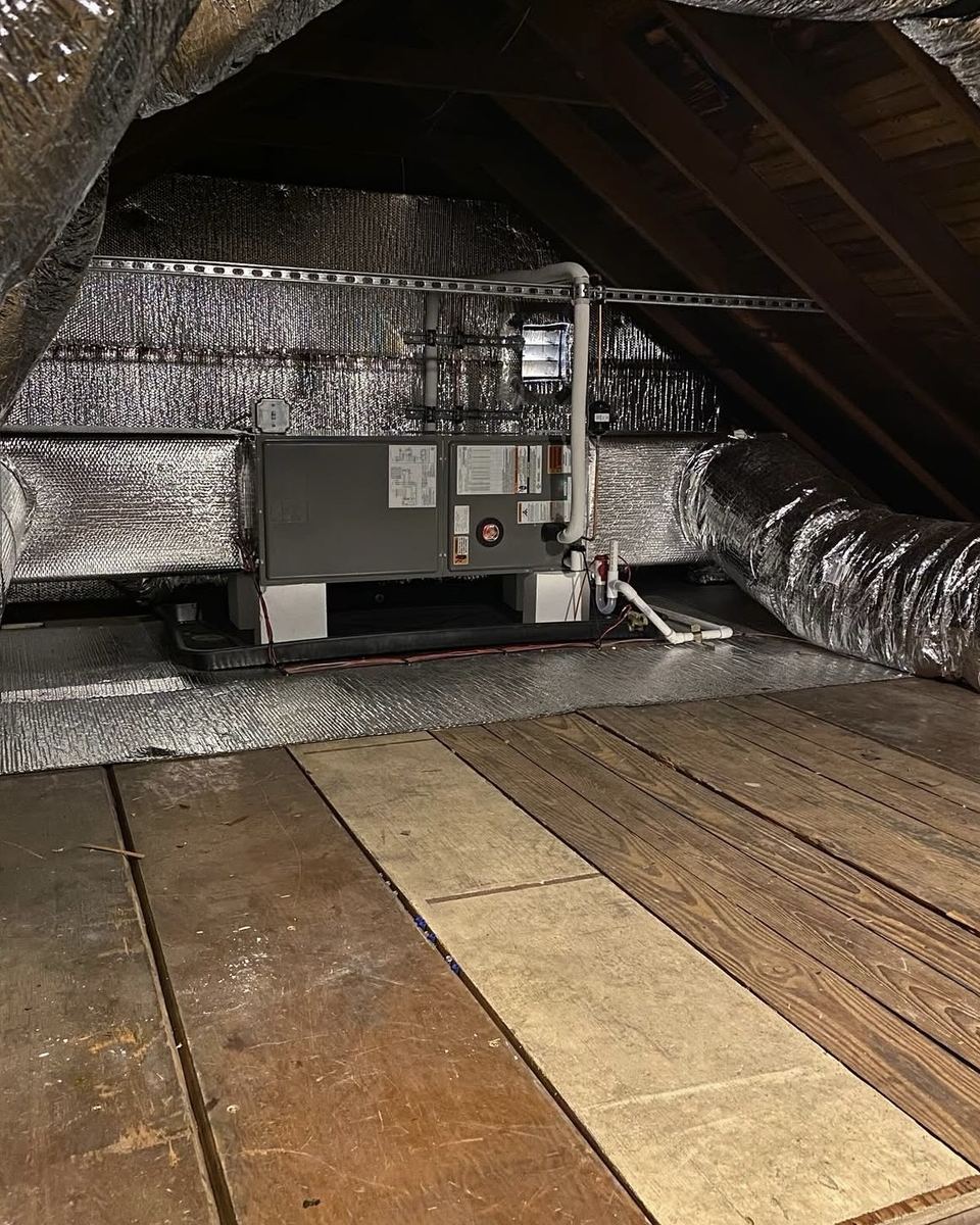 Rheem furnace with sealed ductwork installed in an attic by Jordan Heating and Air Conditioning.